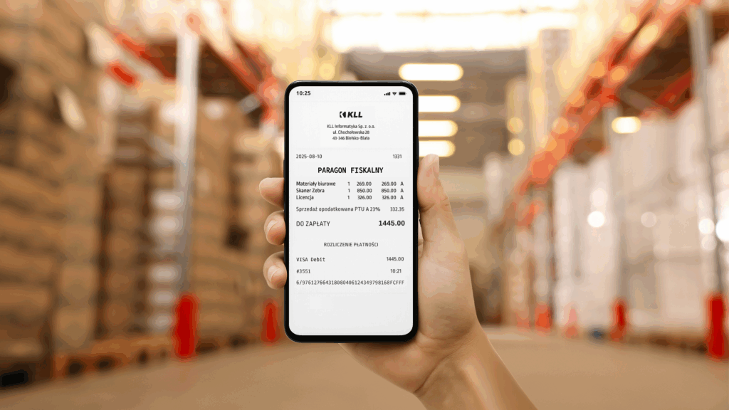 E-paragony w systemie KLL-ERP - telefon z elektronicznym paragonem na tle magazynu